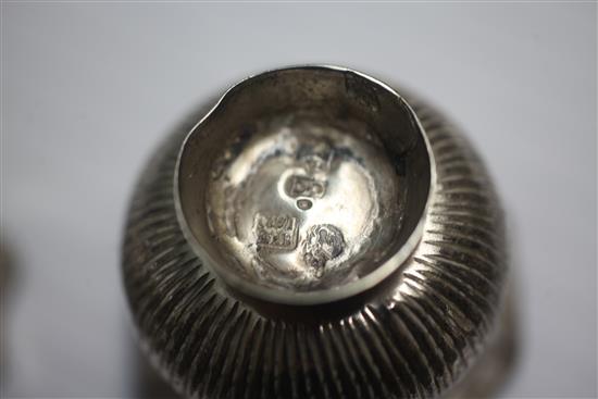 Four assorted late 18th century Russian silver vodka tots, largest 45mm.